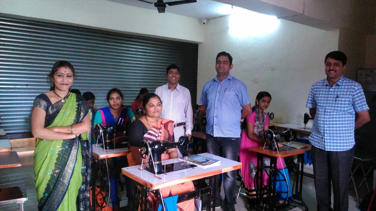 Women learning tailoring on Singer sewing machines at a CDROME training centre, Maharashtra